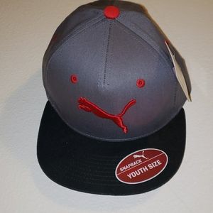 PUMA SNAPBACK HAT in the color Grey/Red/Black
